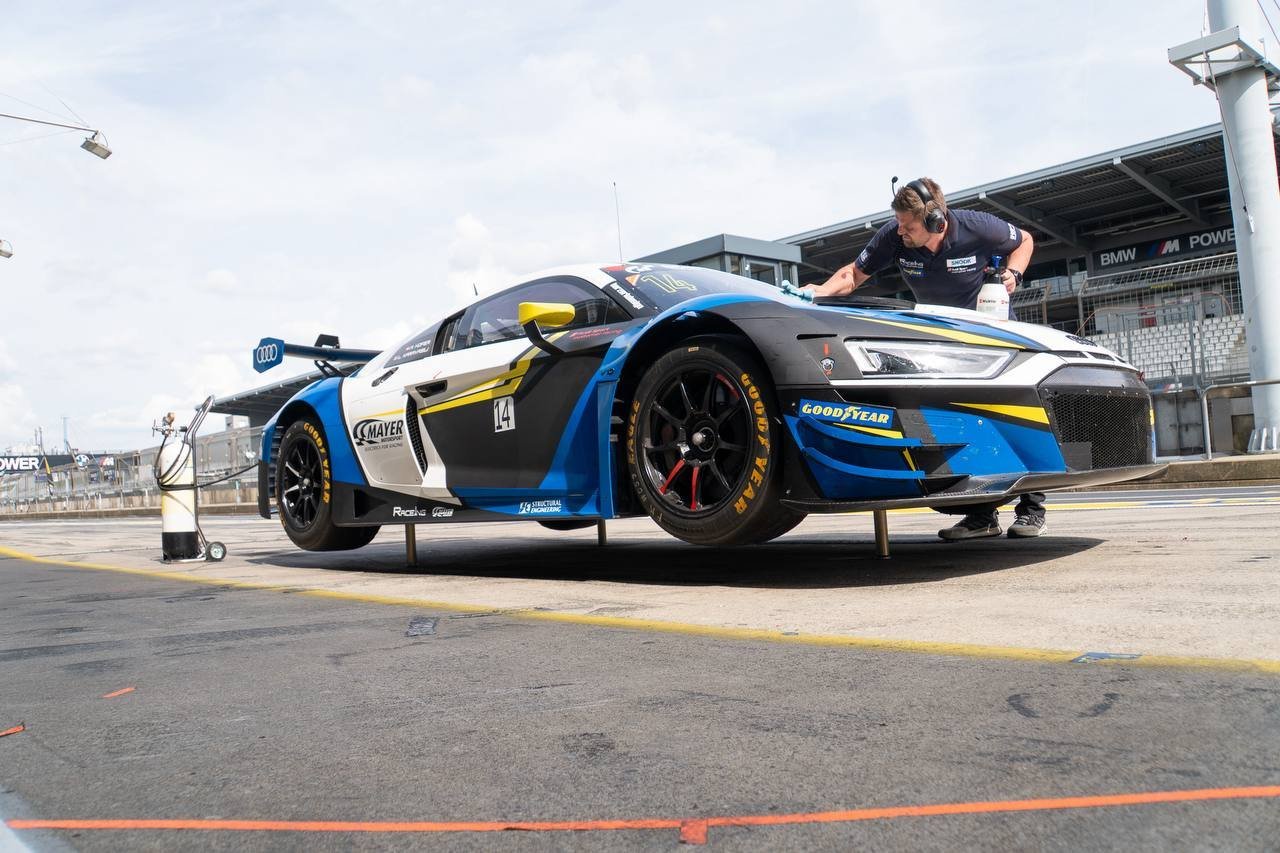 Working on the car in the pit lane